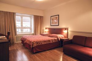 Кровать или кровати в номере Hotel Anna