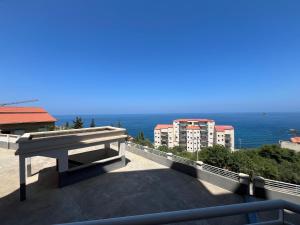 a view of the ocean from the balcony of a building at T2 vue sur mer in Bejaïa