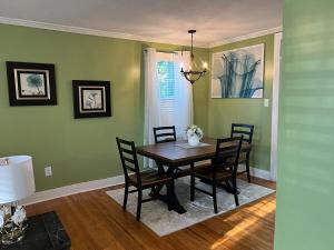 a dining room with a wooden table and chairs at Cute 2 bedroom home ! in Augusta