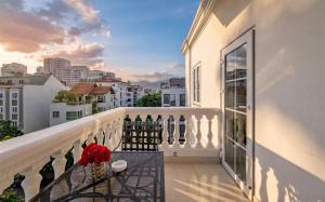 a balcony with a view of a city at Hotel L Odeon Phu My Hung in Ho Chi Minh City
