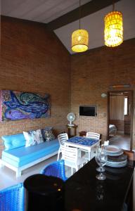 a living room with a couch and a table at Lumar Flats in Paulista