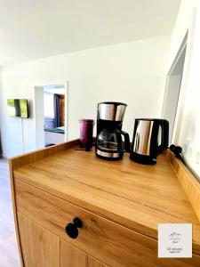 a cabinet with two coffee makers on top of it at Panorama-Glück I & III in Garmisch-Partenkirchen +26 photos