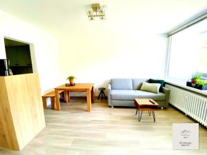 a living room with a couch and a table at Panorama-Glück I & III in Garmisch-Partenkirchen