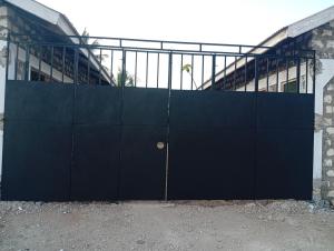 a large blue gate in front of a building at Avana Studio Watamu in Watamu