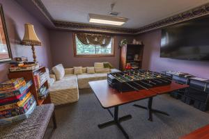a living room with a foos ball on a table at Hearthstone Inn & Suites in Cedarville