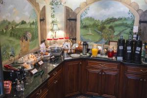 a kitchen with a counter with bottles of wine at Hearthstone Inn & Suites in Cedarville