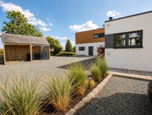 a house with a courtyard and a barn at Bergkultur Sauerland in Medebach
