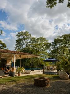 a backyard with a pavilion and a playground at GuanaGlamp in Tamarindo