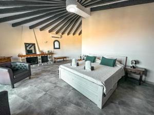 a bedroom with a large bed and a chair at Bona Vista in Calpe +45 photos