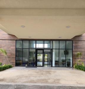an office building with glass doors and windows at City View Luxe Condo in Mandeville