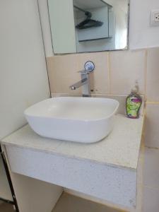 a white sink on a counter in a bathroom at Ocean View in Big Corn Island