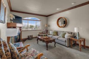 a living room with a couch and a table at Zermatt Mountain Retreat in Midway