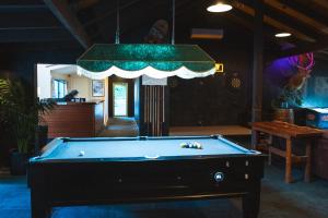 a pool table in a room with a ceiling at Harrietville Hotel Motel in Harrietville