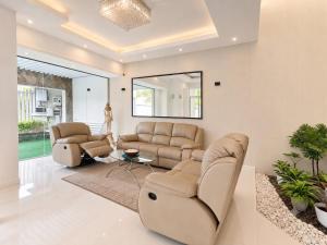 a living room with couches and a table at Apna Colombo in Nawala +39 photos