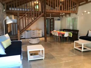 a living room with a couch and a table at Lucica 1 Beachfront House in Lastovo +26 photos