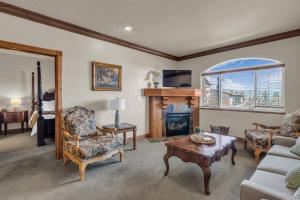 a living room with a couch and a fireplace at Zermatt Mountain Suite and 1BDR in Midway