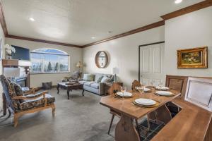 a living room with a table and a couch at Zermatt Mountain Suite and 1BDR in Midway +21 photos