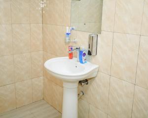 a bathroom with a sink and a shower at Panofu Homestay in Moshi +26 photos