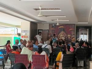 a crowd of people sitting in chairs in a room at SRIPADAVALLABHANIVAS2 pithapuram in Pithāpuram