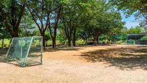 a soccer goal sitting on the ground in a park at Gapyeong ebenzer Pension in Gapyeong
