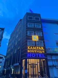 a building with a sign that reads karma boutique hotel at Kampar Boutique Hotel in Kampar