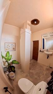 a bathroom with a sink and a toilet at Alianna Homestay in Karimunjawa +20 photos