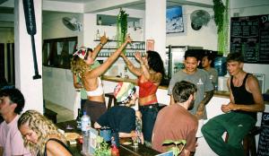 a group of people standing in a room at Gili Pirates Dive & Social Hostel in Gili Trawangan