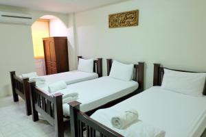 Llit o llits en una habitació de Siam House Interplace