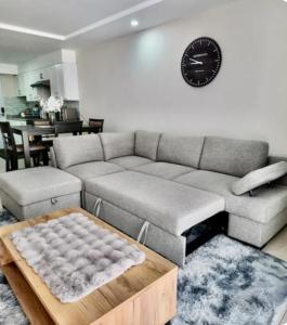 a living room with a couch and a coffee table at Royal Estate in Portmore