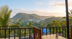 a balcony with a view of a mountain at Rock View Cottage in Ella