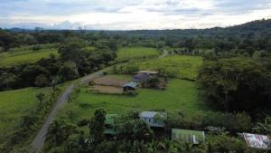 an aerial view of a house in a green field at Boca Tapada Inn in Boca Tapada