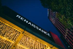 a sign on a building with christmasmas lights at Renaissance Shanghai Putuo Hotel in Shanghai