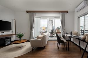 a living room with a view of a city at WH Hotel 310 in Phnom Penh
