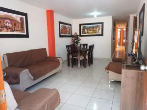 a living room with a couch and a table at La Posada del Inca Chavin in Chavín de Huantar