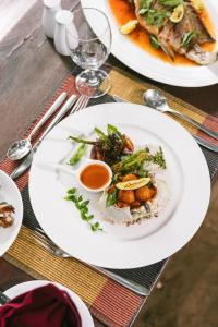 a table with two plates of food on it at Cinnamon Wild Yala in Yala