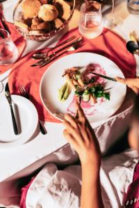a person sitting at a table with a plate of food at Cinnamon Wild Yala in Yala