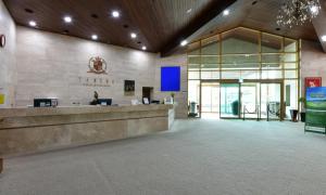 a lobby of a building with a reception desk at Jeju Tameus Golf & Village in Hahwajŏn