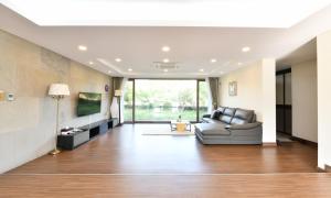 a living room with a couch and a large window at Jeju Tameus Golf & Village in Hahwajŏn