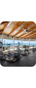a row of exercise bikes parked under a pavilion at Sol y mar in Rosarito Beach