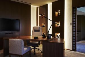 a room with a desk and a chair and a television at Hyatt Regency Kyoto in Kyoto +64 photos