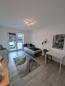 a living room with a couch and a table at Nathalie in Bad Vilbel