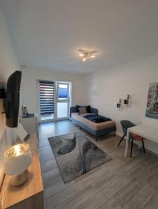 a living room with a couch and a table at Nathalie in Bad Vilbel