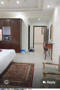 a hotel room with a bed and a piano at Woodford Ayubia in Ayubia +13 photos