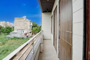 a balcony with a view of a building at Hotel O India Expo Mart Noida Formerly Xponest in Greater Noida +27 photos