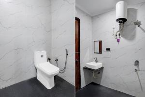 a bathroom with a toilet and a sink at Hotel O India Expo Mart Noida Formerly Xponest in Greater Noida