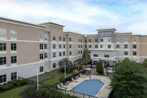 an aerial view of a hotel with a swimming pool at Homewood Suites Mobile in Mobile
