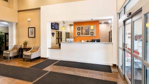 a lobby of a hospital with a counter and chairs at Comfort Inn & Suites in Fort Saskatchewan +29 photos