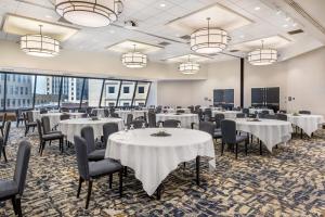 a banquet room with tables and chairs and chandeliers at Radisson Blu Fargo in Fargo