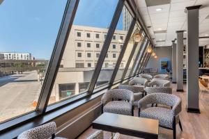 a row of chairs in a room with large windows at Radisson Blu Fargo in Fargo