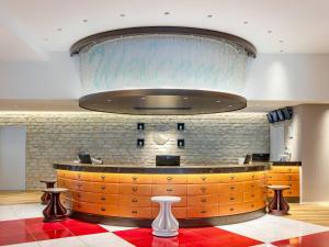 a large chandelier above a counter in a restaurant at Comfort Suites Tokyo Bay in Urayasu
